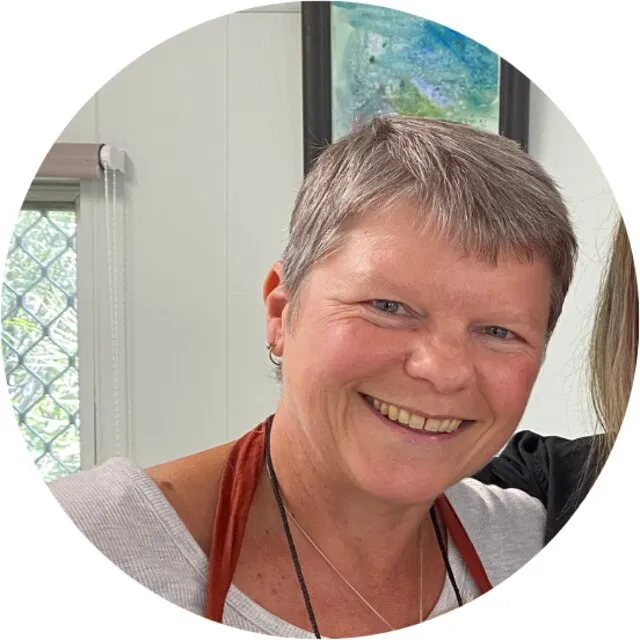Cheryl Findlay smiling indoors at the House